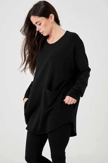 Woman wearing Tencel oversized top with pockets in black, Canadian made women's loungewear, front